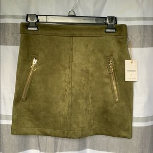 Suede green mini skirt with pockets